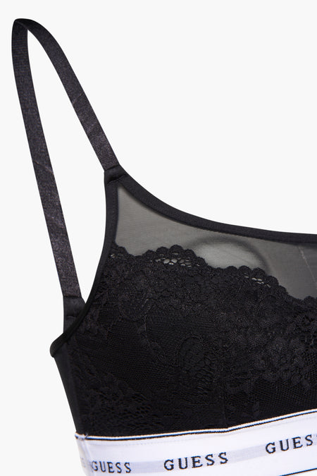 Zwarte beha van Guess met kanten details en een elastische band met logo.
