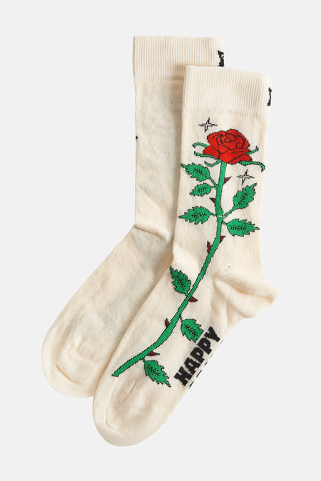 Ecru sokken van Happy Socks met rode roos, groene steel en zwarte tekst "Happy".
