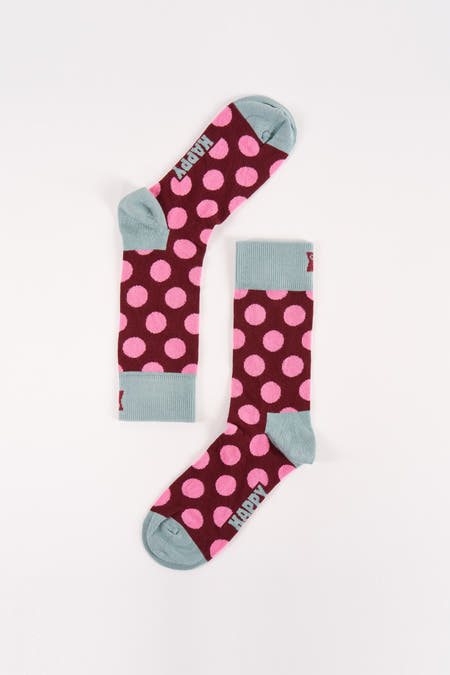 Chaussettes rouges à rayures de Happy Socks, avec un bord bleu clair et le logo "HAPPY".