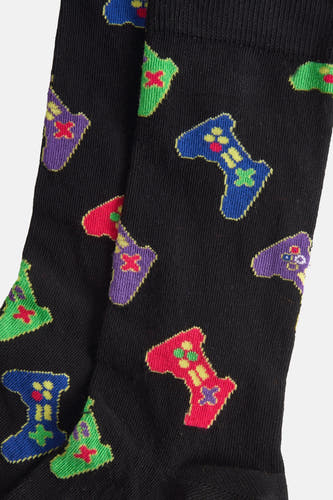 Chaussettes noires de Happy Socks® avec un motif de manette de jeu multicolore et ludique.