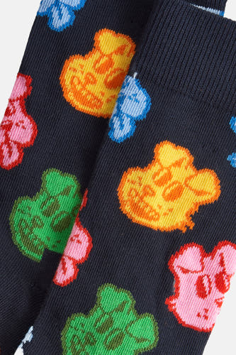 Multikleurige sokken van Happy Socks, met een kleurrijk patroon van cartoonfiguren.

