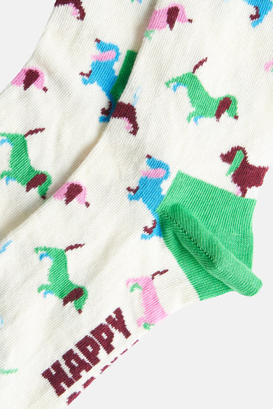 Multikleurige sokken van Happy Socks®, met een patroon van kleurrijke paarden en groene details.