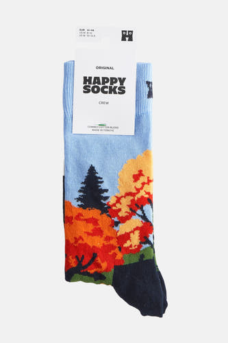 Blauwe sokken van Happy Socks met een patroon van herfstbomen en een donkerblauwe teen.
