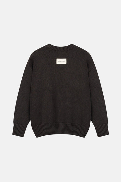 Bruine trui met ronde hals van ANOTHER COTTON LAB, met een label in het midden.