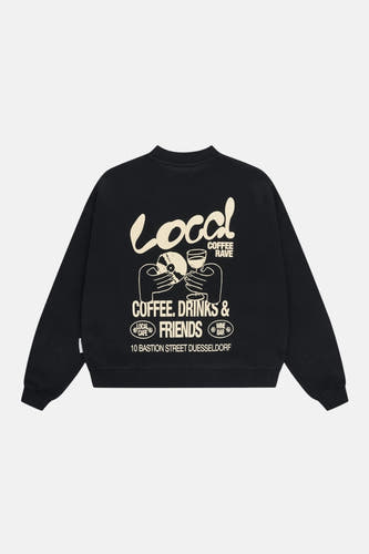 Zwarte sweater van ANOTHER COTTON LAB met witte grafische opdruk van "Local Coffee Rave" op de rug.