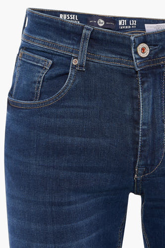 Blauw denim tapered jeans van Petrol Industries, met stiksels en een knoopsluiting.
