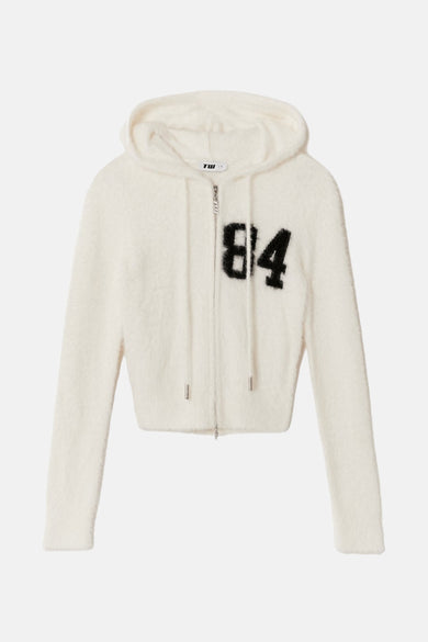 Witte cardigan van TALLY WEIJL, met capuchon, lange mouwen en zwarte "84" op de borst.