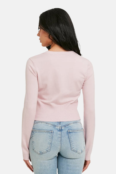 Cardigan rose de TALLY WEIJL, à manches longues et à ourlet côtelé, porté avec un jean, vue de dos.
