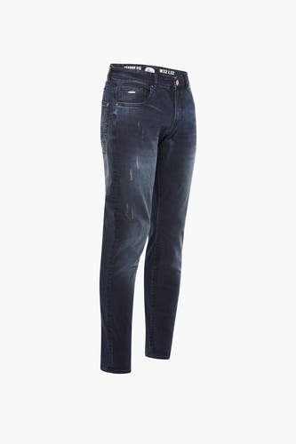 Donkerblauwe slim jeans van Petrol Industries, met een verweerde wassing en subtiele details.