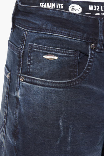 Donkerblauwe denim jeans van Petrol Industries, met een subtiele vintage wassing en metalen details.