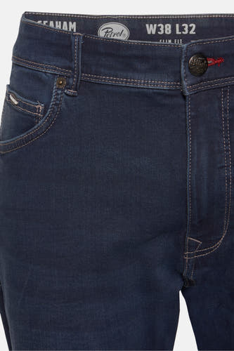 Jean denim bleu marine slim fit de Petrol Industries, avec des boutons et des détails métalliques.