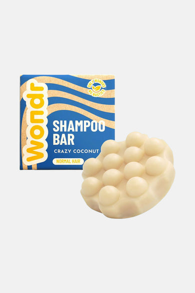 Multicolor shampoo bar van WONDR CARE met patroon en decoratieve bolletjes.