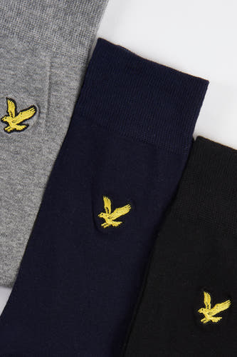 Grijze sokken van Lyle & Scott, met een geborduurde gouden adelaar.