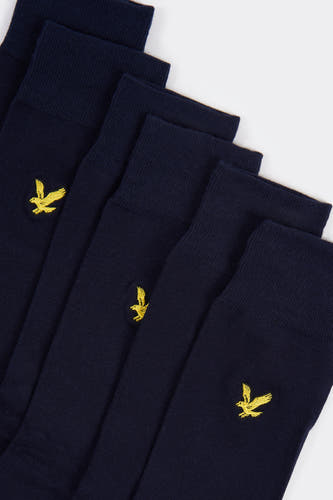 Blauwe sokken van LYLE & SCOTT, met een geborduurd geel logo op de enkel.
