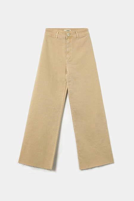 Beige colorbroek van TALLY WEIJL met een wijde pijp en gerafelde zoom.