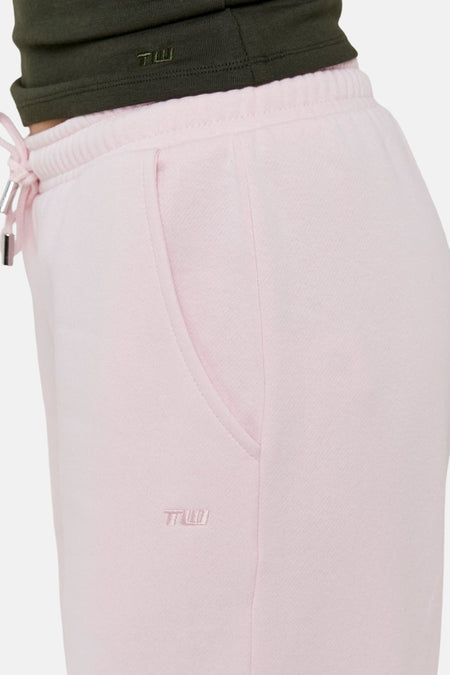 Roze joggingbroek met zak en logo.
