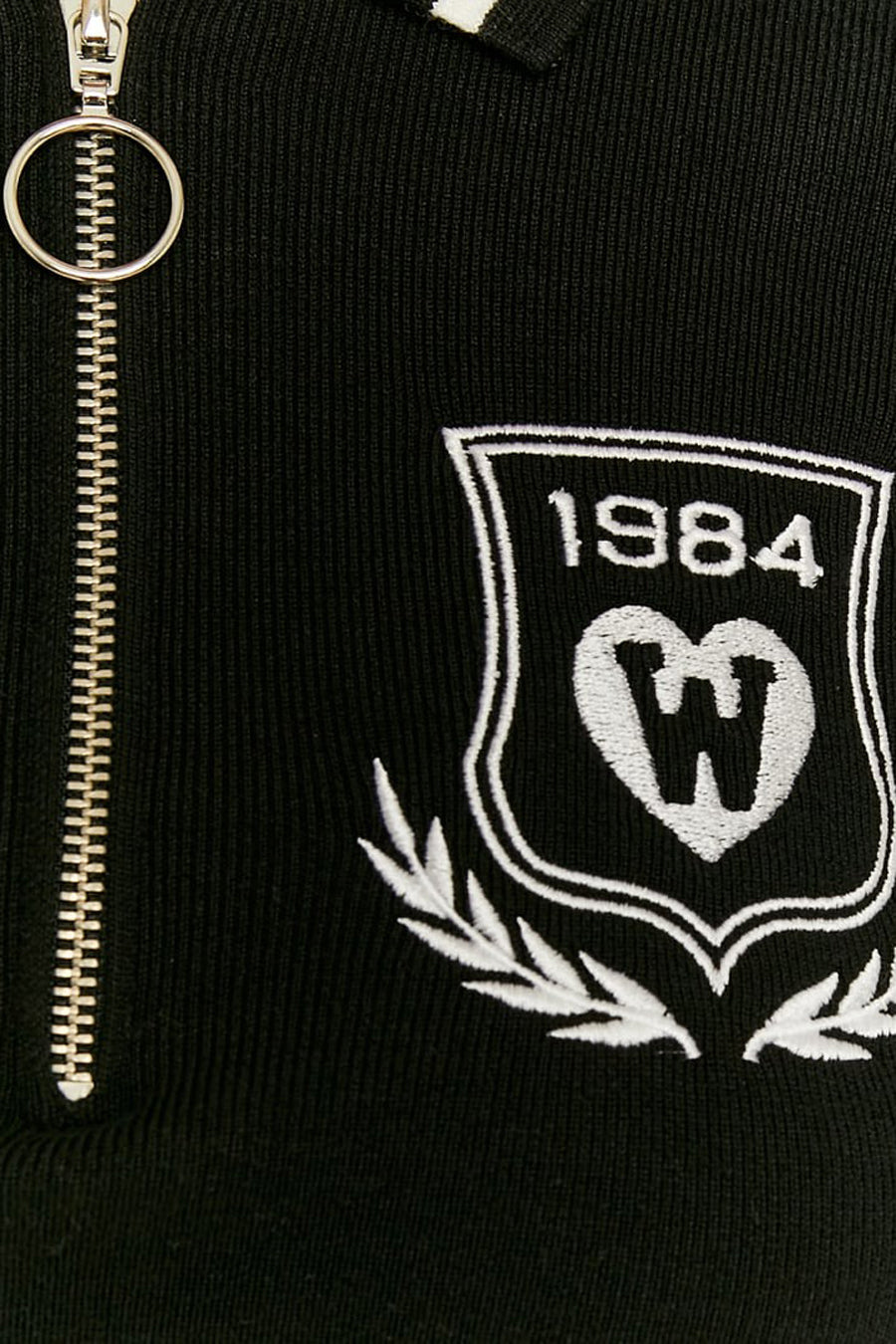 Zwarte trui met V-hals van TALLY WEIJL, met rits en geborduurd logo.