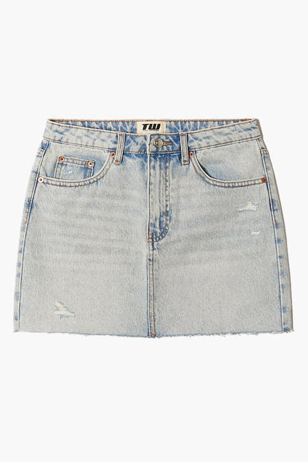 Short light blue denim skirt from TALLY WEIJL, with distressed details and a ruffled hem.