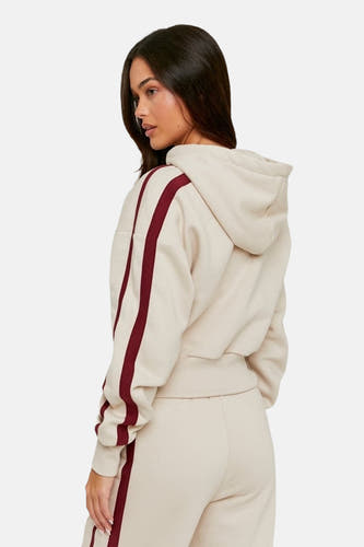 Gilet beige de TALLY WEIJL, avec des rayures bordeaux sur les manches et un capuchon.