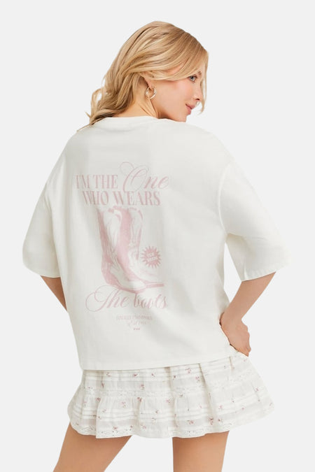 T-shirt blanc TALLY WEIJL avec imprimé bottes de cowboy roses au dos et manches courtes.