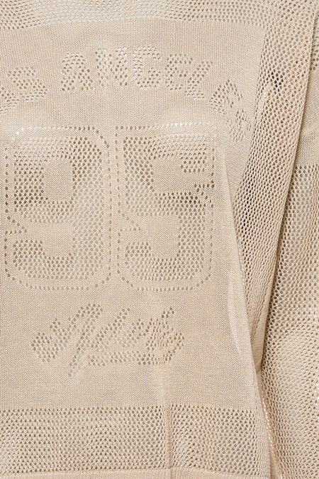 Pull écru ADORE avec détails ajourés, numéro 93 et motif 'Amour'.