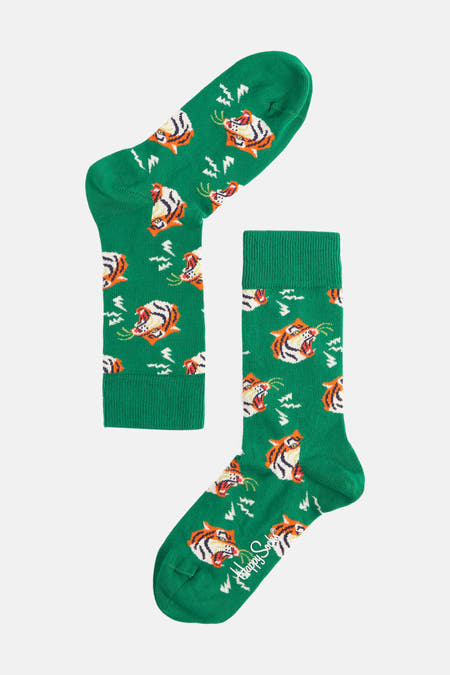 Groene sokken van Happy Socks met een patroon van tijgers en bliksemschichten.