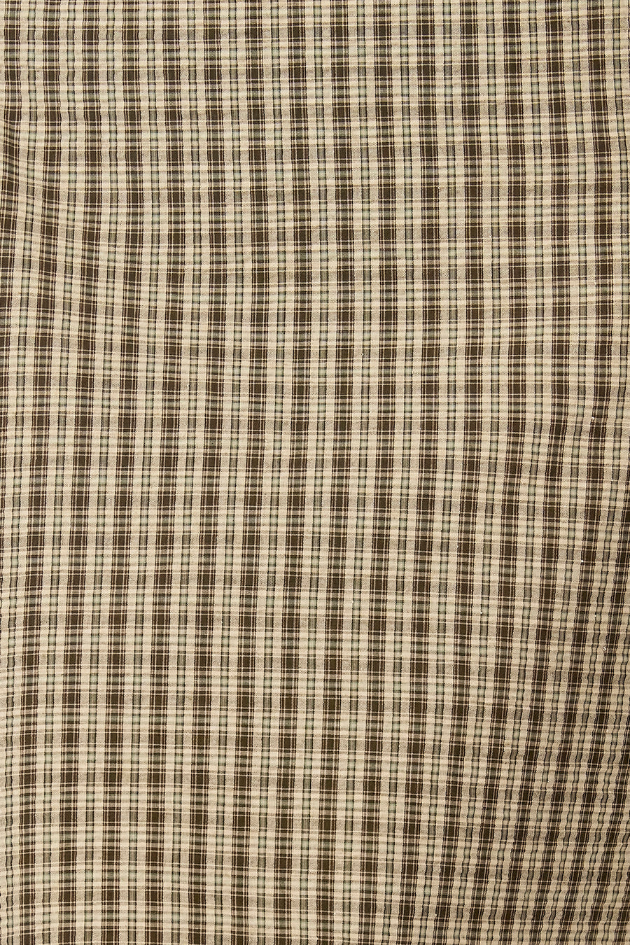 Robe verte sans manches d'Unwind, avec un motif à fines carreaux marron et crème.