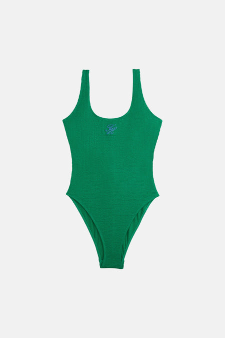 Maillot de bain vert de TOMMY JEANS, avec détails de logo brodés et une surface texturée gaufrée.