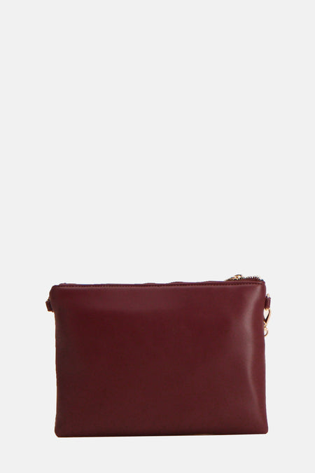 Bordeaux schoudertas van VALENTINO BAGS met goudkleurige details en een ritssluiting.
