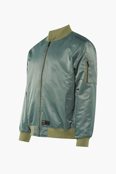 Groene korte jas van VANS 'OFF THE WALL' van glanzend nylon met olijfgroene geribde boorden en mouwzak.