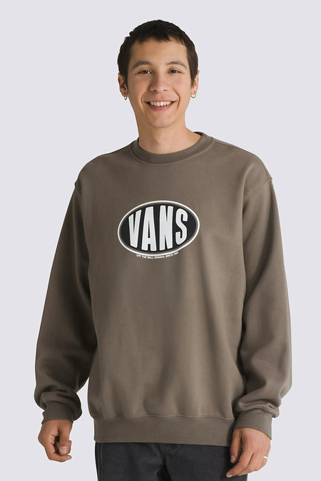 Bruine sweater met ronde hals van VANS “OFF THE WALL”, met een ovale Vans logo op de borst.
