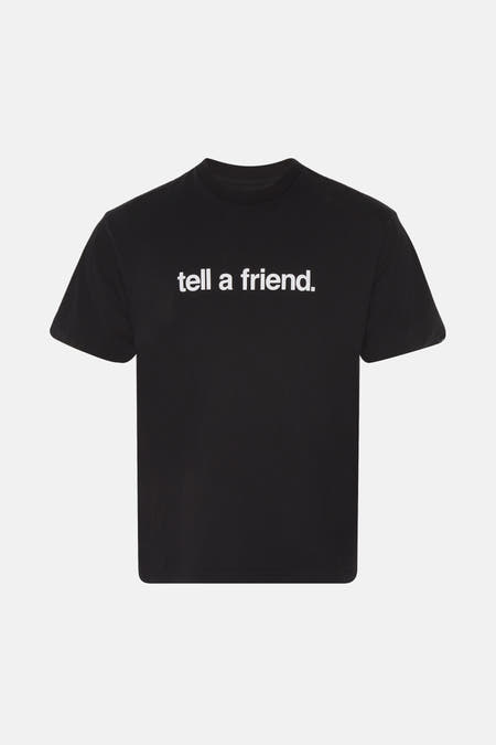 Zwart T-shirt met korte mouwen van VANS “OFF THE WALL” met witte tekstprint op de voorkant.