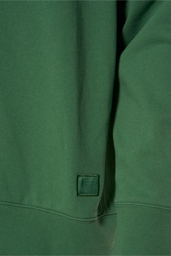 Groene sweater van VANS “OFF THE WALL” met ton-sur-ton logopatch op de zoom.