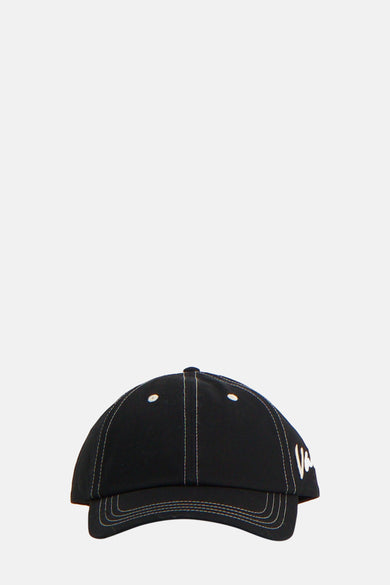 Zwarte pet van VANS “OFF THE WALL”, met contrasterende stiksels en een geborduurd logo.
