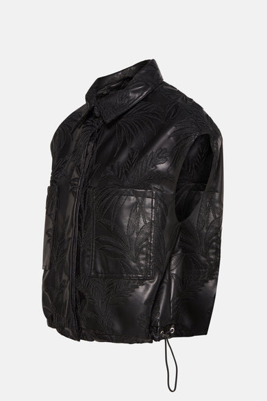 Zwarte bodywarmer van Guess, met geborduurde palmbladmotieven en trekkoord aan de zoom.