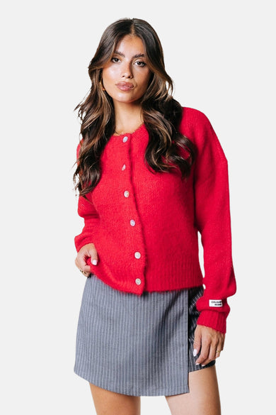 Gilet rouge de COLOURFUL REBEL, avec des manches longues, une fermeture à boutons et une fine texture veloutée.
