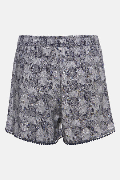 Short bleu de HAILYS avec motif feuilles et bordure pompon décorative à l'ourlet.